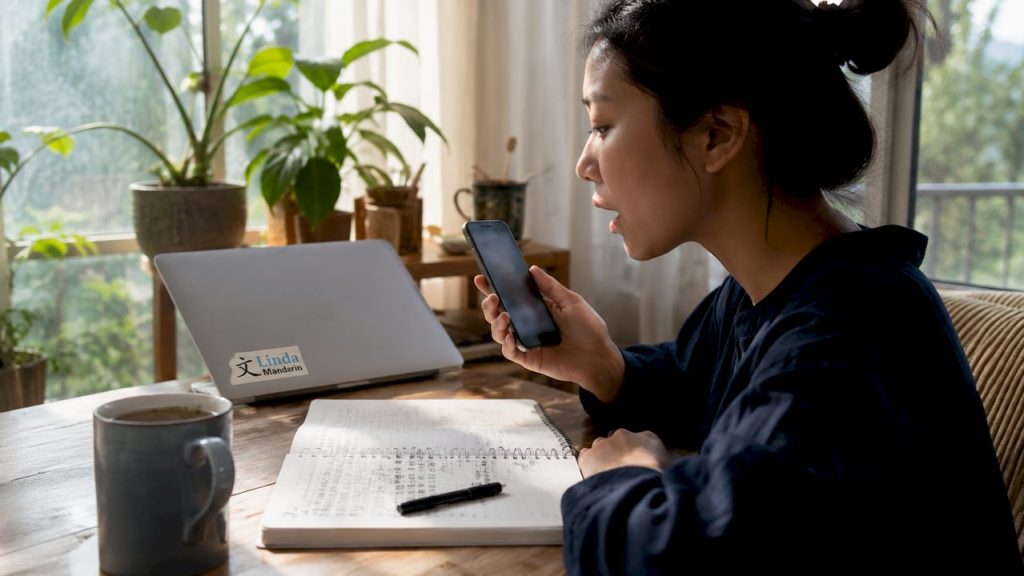 Young woman practicing Mandarin pronunciation