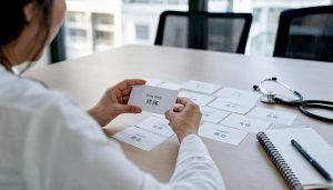 Hands sorting medical Mandarin flashcards