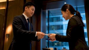 Professionals exchanging Chinese business cards