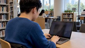 Adult learner typing Chinese with Pinyin